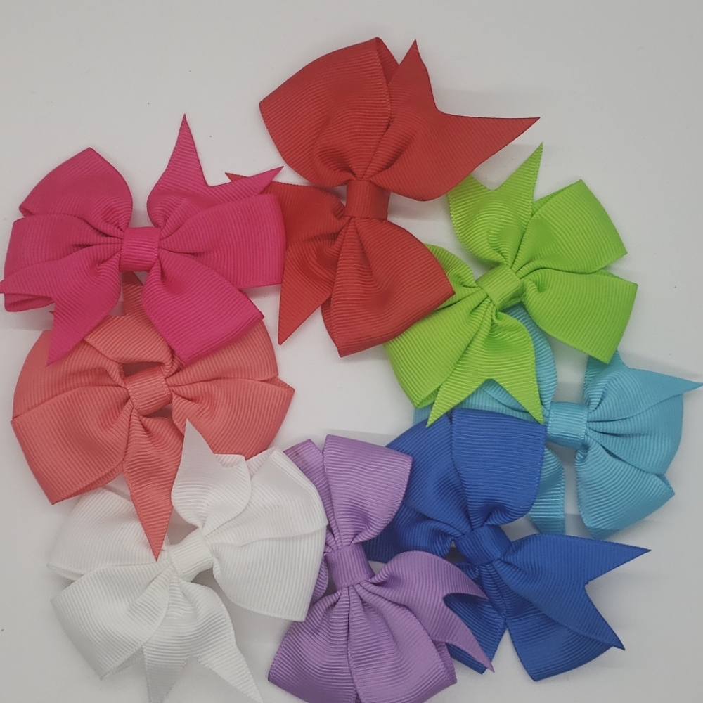 8pc lot. Multicolored 3" Hair bow Clips.